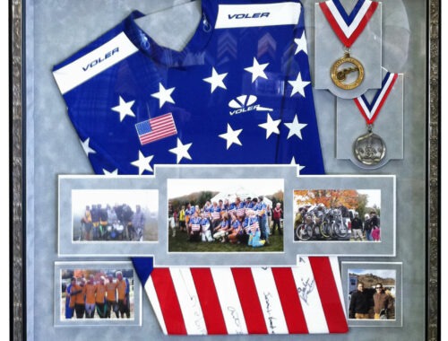 Custom shadow box with cycling jersey, medals, and team photos framed at Framer's Market & Gallery in Prescott