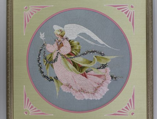 Holiday angel embroidery custom framed with decorative mat at Framer's Market & Gallery in Prescott